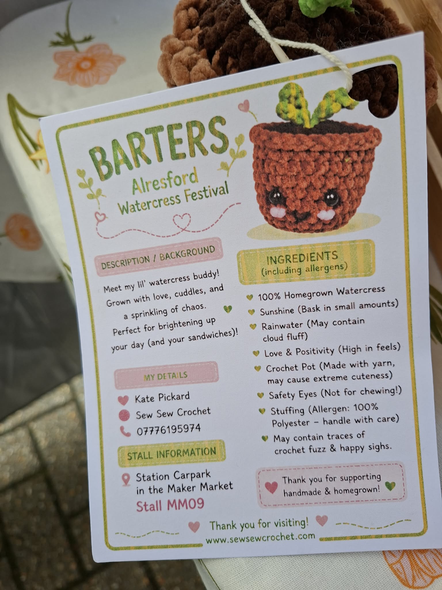 Card with a crocheted watercress plant and event information for BARTERS Alresford Watercress Festival.