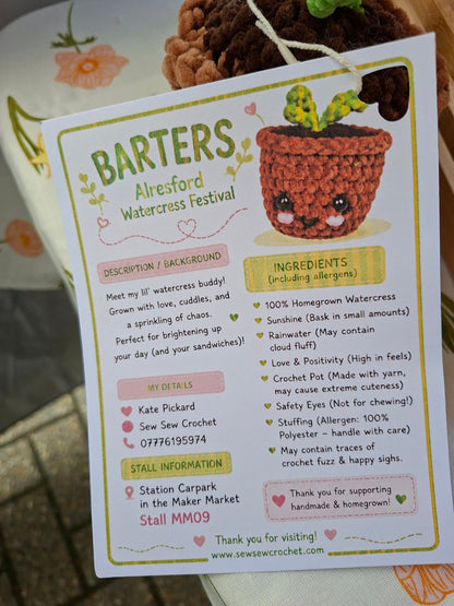 Card with a crocheted watercress plant and event information for BARTERS Alresford Watercress Festival.