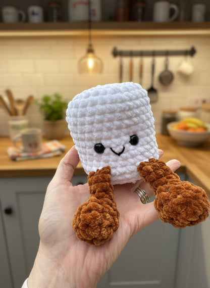 hand holding white plush marshmallow